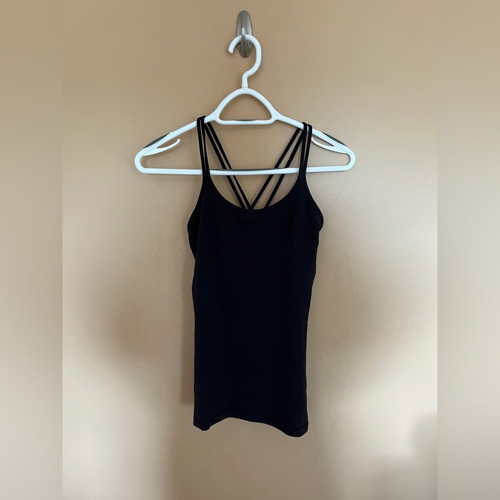 Size 4 Lululemon tank top. Built in sports bra.